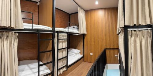 a room with three bunk beds in it at Peanut Stay Hostel in Hanoi