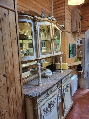 a kitchen with wooden walls and wooden flooring and a wooden counter top at La Garette in Elbeuf-sur-Andelle