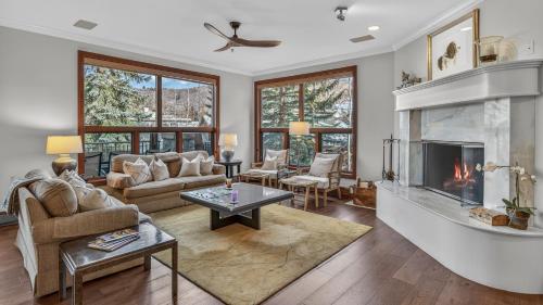 a living room with a fireplace and a couch at Chalet Premio in Beaver Creek