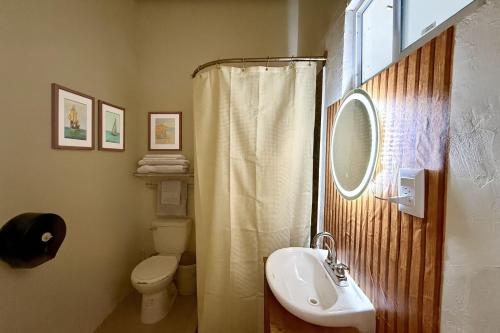 a bathroom with a sink and a toilet and a shower at Puerto 201 ROOMS in Veracruz