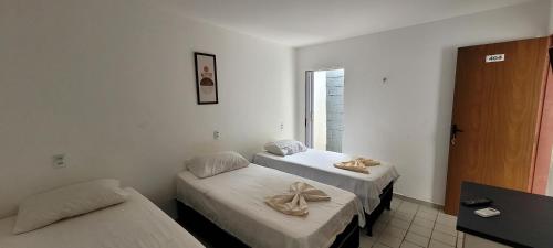 Postel nebo postele na pokoji v ubytování Pousada Primeiro Sol