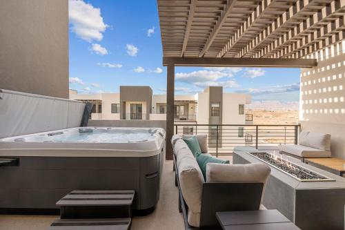 a hot tub on the balcony of a house at Weekend Vibes townhouse in St. George