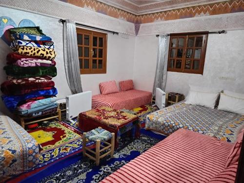 Postel nebo postele na pokoji v ubytování Dar Imoughlad