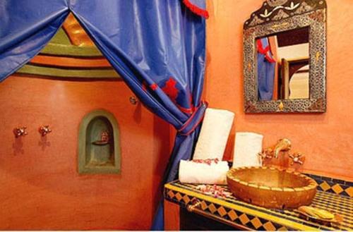 a bathroom with a sink and a mirror at Maison Do in Marrakesh