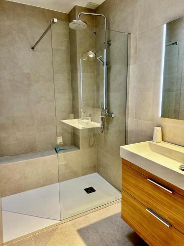a bathroom with a shower and a sink at Villa Aloe - chill in the sun! in Vera