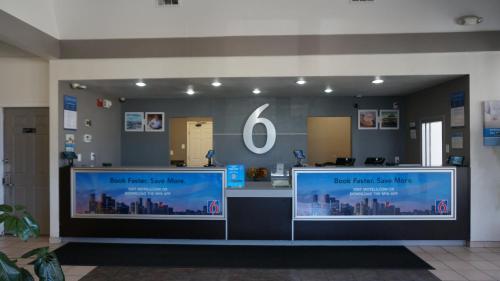 a store front with two large windows in a lobby at Studio 6 Belmont, CA San Francisco Redwood in Belmont