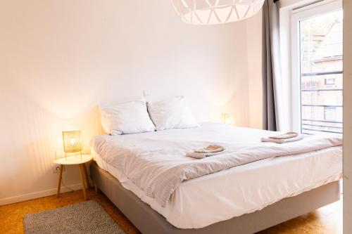 En eller flere senge i et værelse på Enroutehome