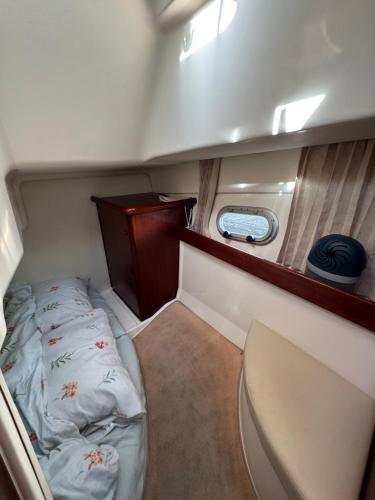 a small room with a bed in the back of a boat at Barco Marina de Cascais in Cascais