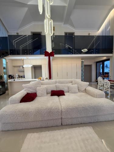 a large white couch in a living room at Sadova Loft View in Sadova