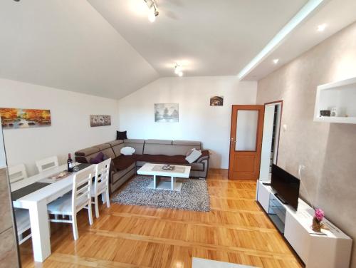 a living room with a couch and a table at Apartman NN Trebinje in Trebinje