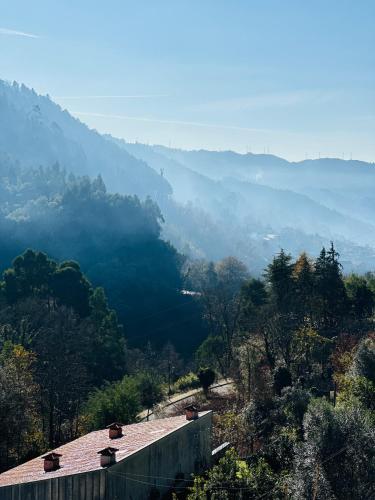 a view of a valley with mountains in the distance at Mountain View Guest House,Geres in Geres