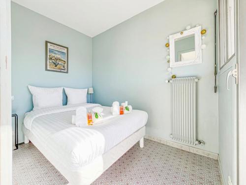 a bedroom with two beds and a window at Cannes Montfleury - Comfortable accommodation Center in Cannes