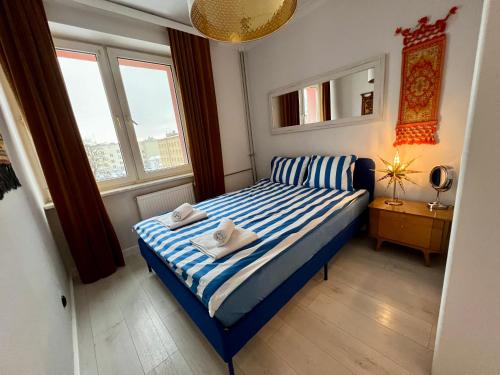 Postel nebo postele na pokoji v ubytování Apartament Rockabilly