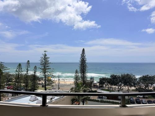 a view of the beach from the balcony of a condo at 706TheSands Beachfront Apartment at the centre of Surfers Paradise in Gold Coast