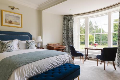 Postel nebo postele na pokoji v ubytování Moore Lodge