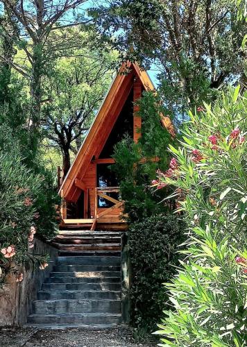 a small house with stairs leading up to it at A Mi Manera Apart in Merlo