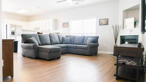 a living room with a couch and a fireplace at The Cozy Hub in Simpsonville