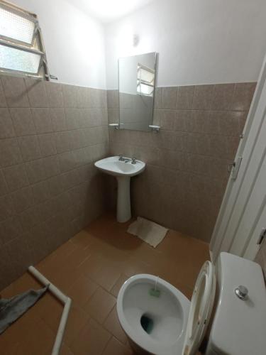 a bathroom with a toilet and a sink at Las Vertientes in Tanti