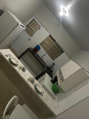an overhead view of a small kitchen with a sink at Casa da Villa Santa Rita in João Pessoa