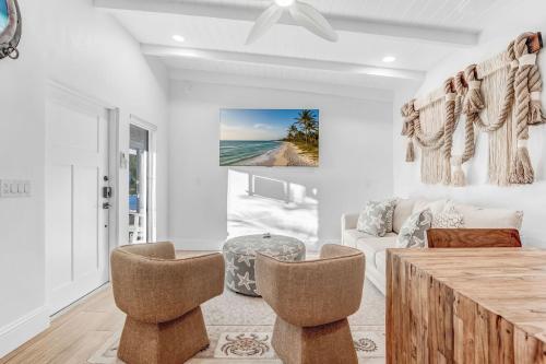a living room with a couch and a table at Anchor Inn & Cottages in Sanibel