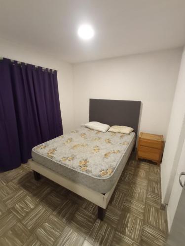 a bedroom with a bed in a room at Las Vertientes in Tanti