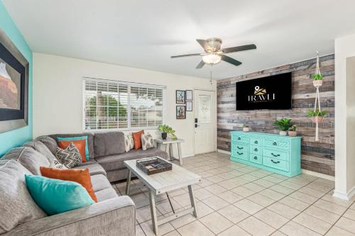 a living room with a couch and a ceiling fan at Cozy Tempe Casa with Heated Pool 5 Minutes to ASU in Tempe