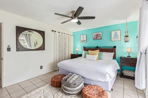 a bedroom with a bed and a ceiling fan at Cozy Tempe Casa with Heated Pool 5 Minutes to ASU in Tempe