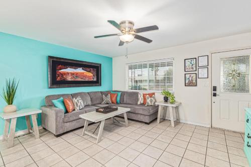 a living room with a couch and a ceiling fan at Cozy Tempe Casa with Heated Pool 5 Minutes to ASU in Tempe
