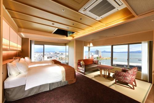 a bedroom with a bed and a large window at Yumotokan in Otsu