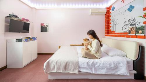 En eller flere senge i et værelse på Gapyeong Haneuldari pet pension