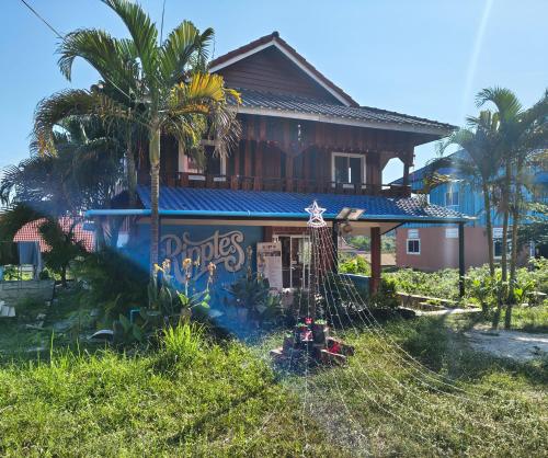 a house with a fence in front of it at M'Pai Bay 23 Ripples Guesthouse and Sky Bar in Koh Rong Sanloem