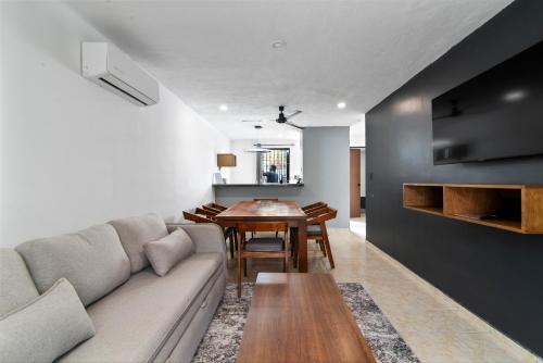 a living room with a couch and a table at Elegante Casa Completa. Merida, Yucatan / House MR in Mérida