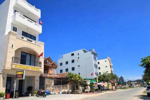 a group of buildings on the side of a street at Sunrise Hotel Thiên Cầm in Hà Tĩnh