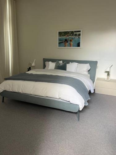 a bedroom with a large bed in a room at Portsea Paramount - When only the best will do in Portsea