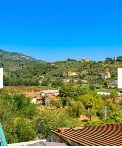a view of a city with trees and buildings at Dimora del Viaggiatore Montecatini Terme in Serravalle Pistoiese