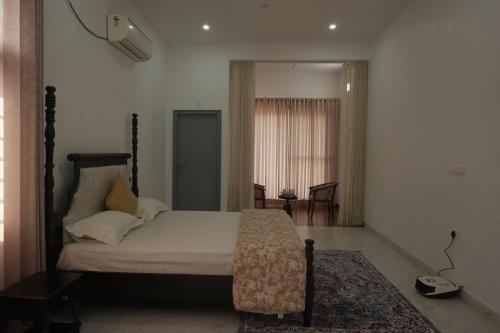 a bedroom with a bed in a room at Jagir villa in Udaipur