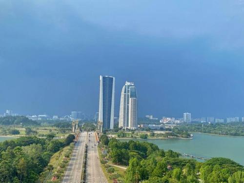 a view of a city with tall buildings and a river at PICC Seruling Precinct 5, 62200 Putrajaya 3BR Homestay in Putrajaya