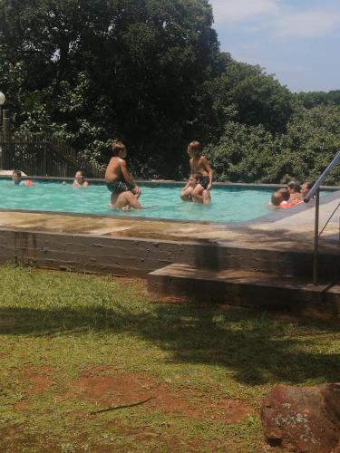 a group of people in a swimming pool at Angers Aweigh, Hibberdene Chalet 86 in Hibberdene
