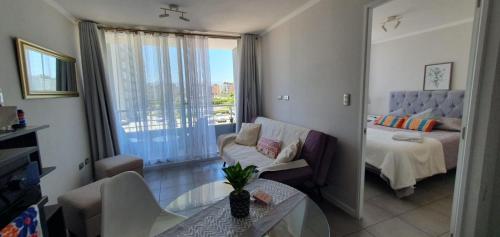 Een bed of bedden in een kamer bij I A pasos de la playa y del centro