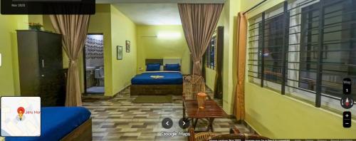 En eller flere senge i et værelse på Jeru Homes