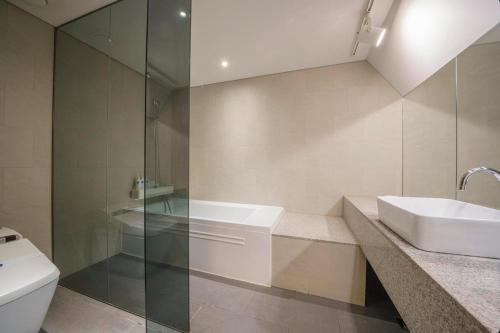 a bathroom with a sink and a toilet at Seocho H hotel in Seoul