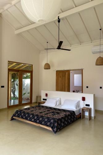 a bedroom with a large bed in a room at Madi House in Matara