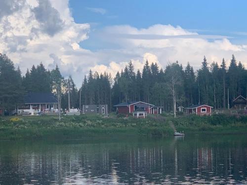 a group of houses next to a body of water at Saagala Village in Tornio