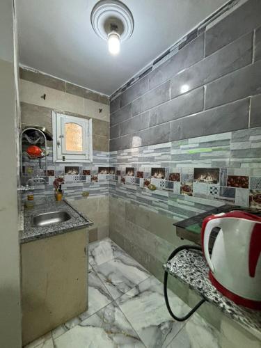 a bathroom with a sink and a tub at Alaraby 2 in Az Zaytīyah