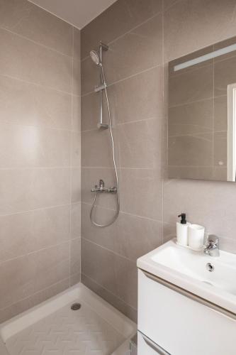 a bathroom with a shower and a sink at Charming and air-conditioned - Close to Paris in Le Pré-Saint-Gervais