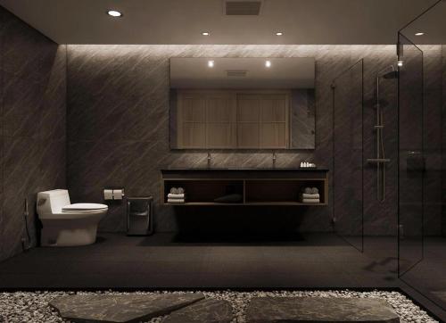 a bathroom with a toilet and a glass shower at Zen Essence Khao Yai in Ban Tha Maprang