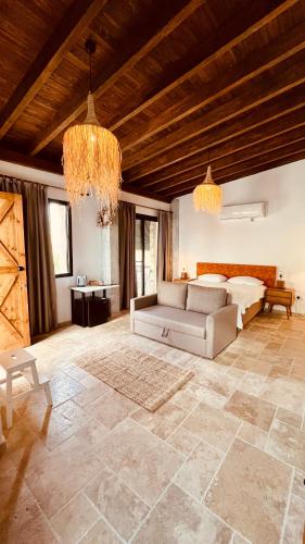 a living room with a couch and a table at The Iskemleci Guest House in Lefkosa Turk