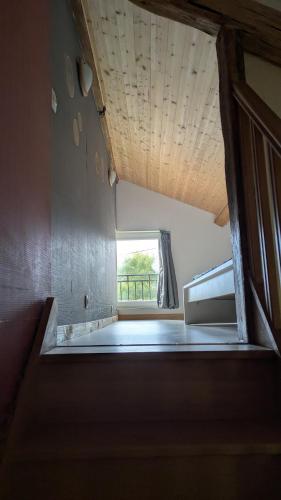 a view of a room with a window at Independent studio in nature in Saint-Valérien