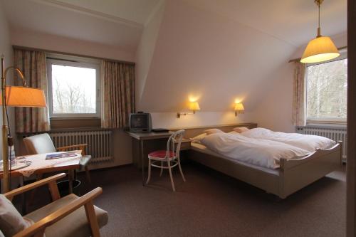 מיטה או מיטות בחדר ב-Hotel Gasthaus Tröster