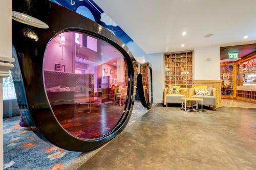 a room with a large mirror on the wall at Manchester Portland By Sunday in Manchester